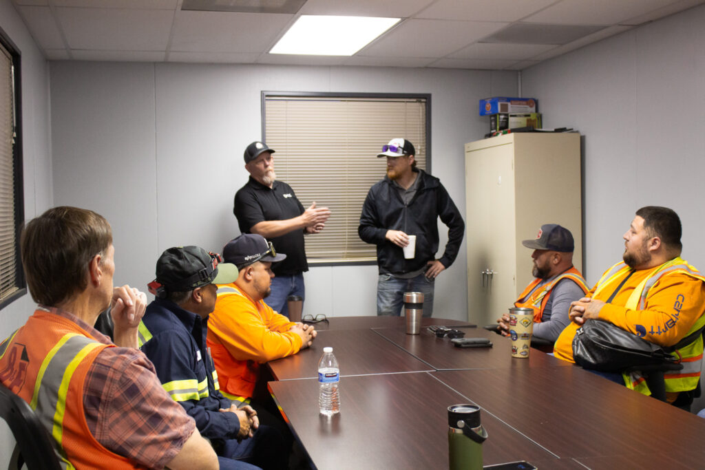 Drivers receiving a safety tool box meeting.